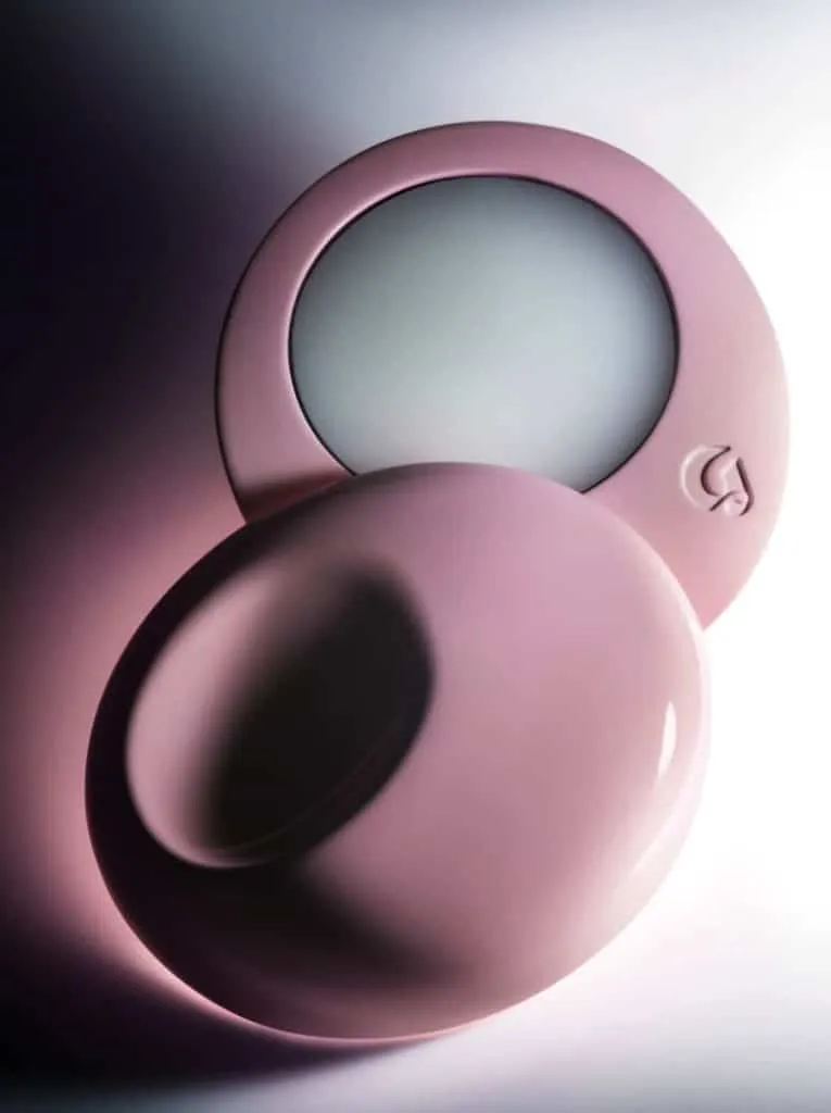 Glossier You solid perfume in a pink round compact