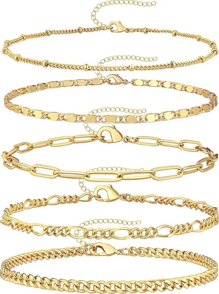 Five gold chain bracelets in curb, paperclip, figaro and oval links