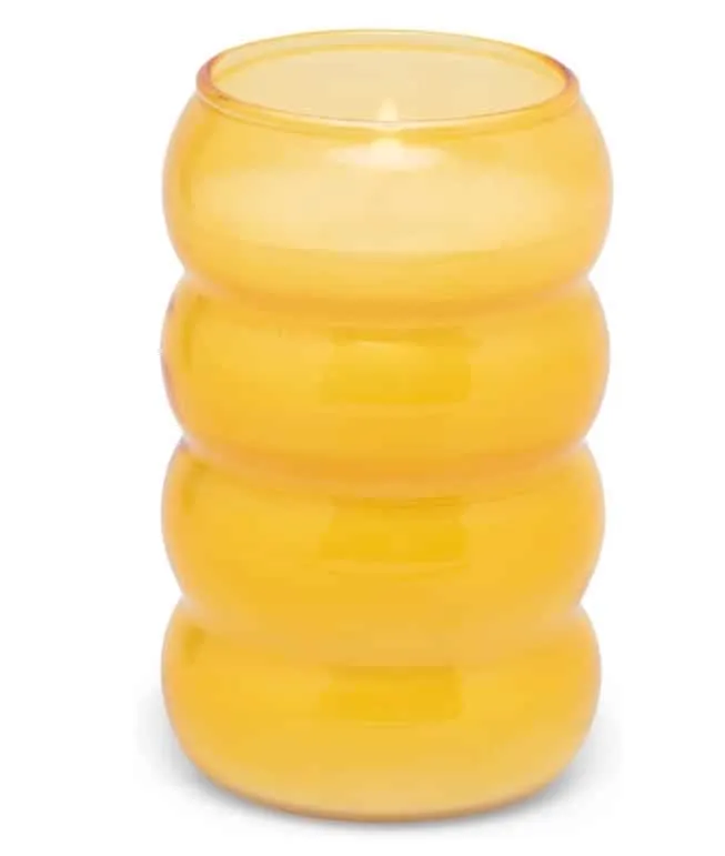 Short yellow glass candle with a ribbed, bubble-shaped holder