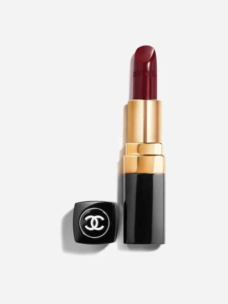 Chanel Rouge Coco lipstick in a deep red shade with its gold and black case