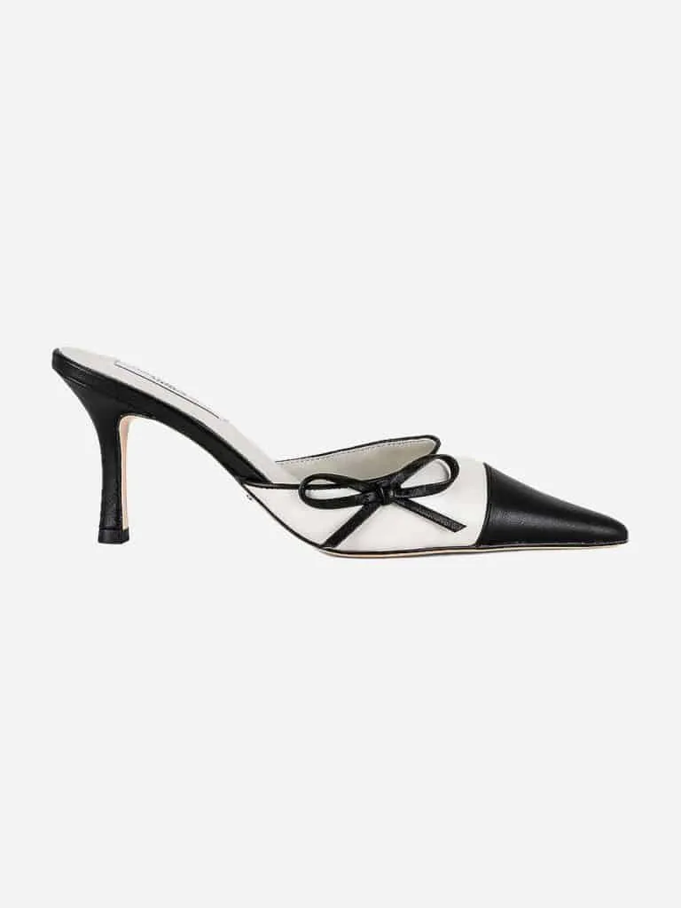 Cream and black Tony Bianco Shirley mule with a black toe cap, black bow and stiletto heel