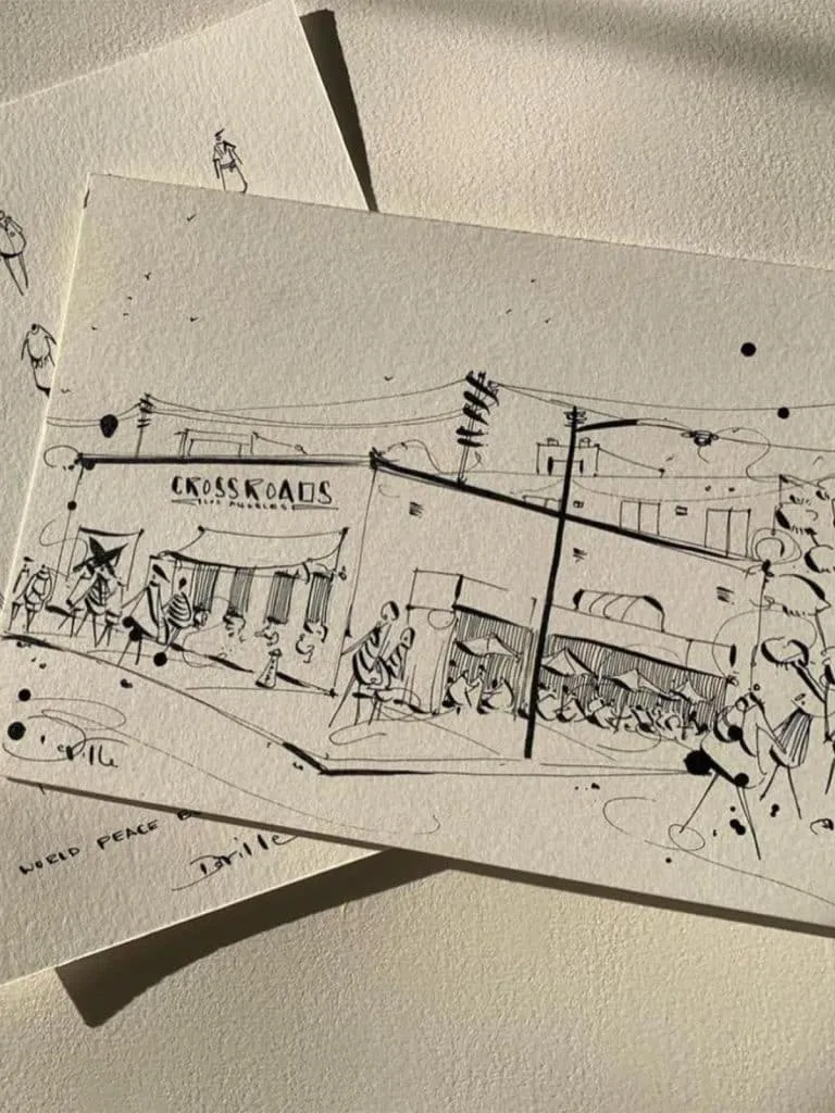 Ink sketch postcard of Crossroads Los Angeles with outdoor seating, awnings and sidewalk figures