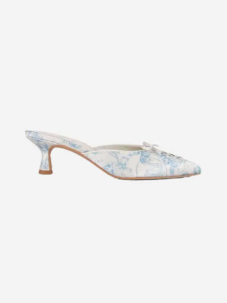 White and baby blue floral Dolce Vita x For Love and Lemons kitten heel mule with a toe lace bow