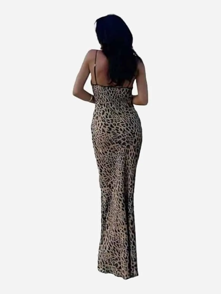 Back view of a woman in a strappy leopard print maxi dress
