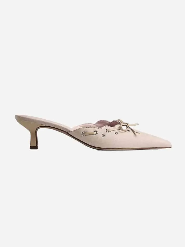 Beige NA-KD eyelet kitten heel mule with scalloped edge, gold grommets and a lace bow