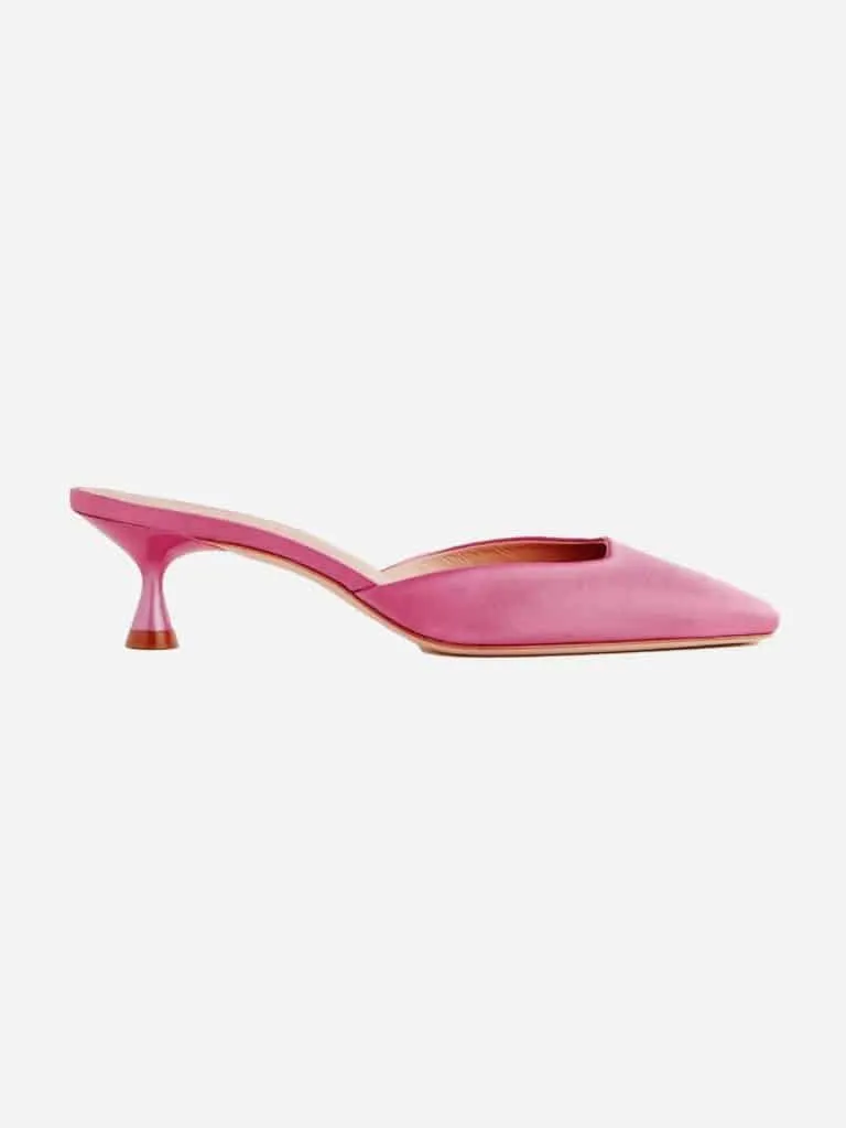Bright pink suede Reformation Daniela kitten heel mule with a pointed toe