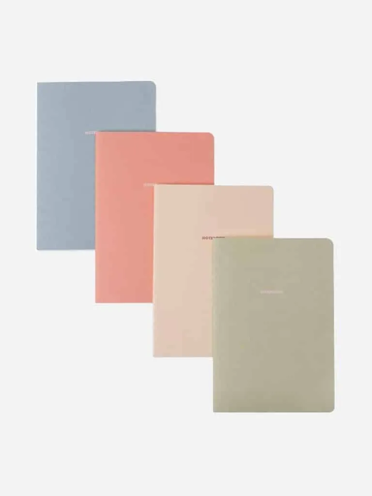 Soft cover notebooks in blue, coral, blush and sage