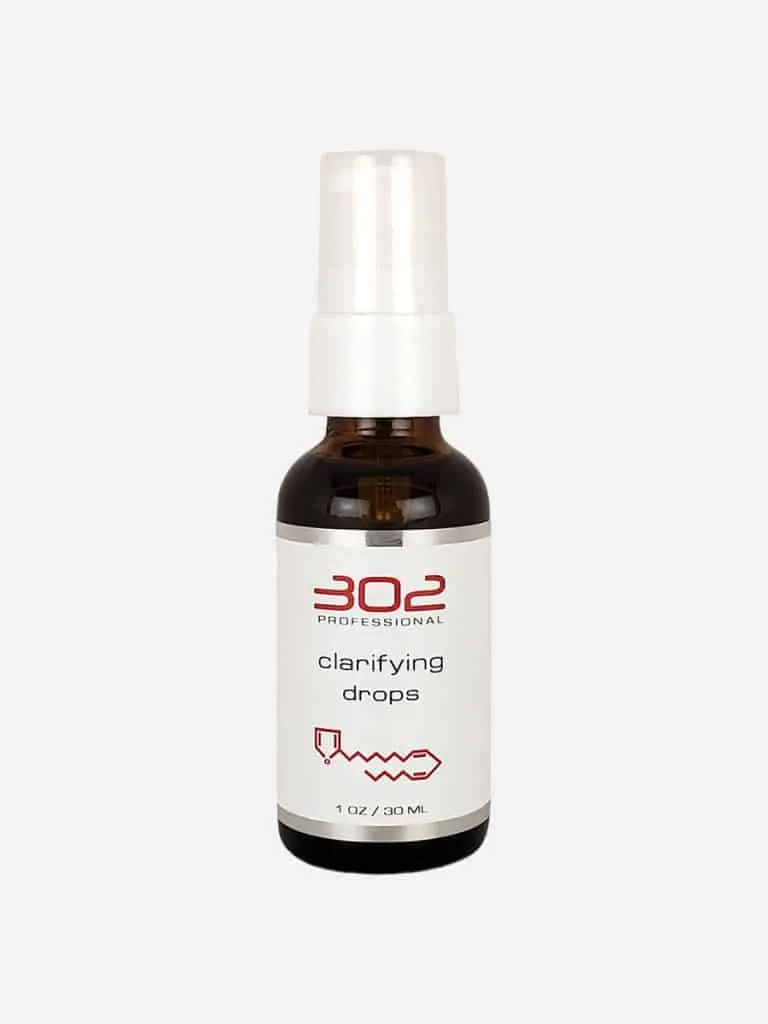 302 Professional Clarifying Drops in a dark amber pump bottle