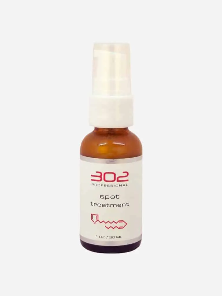 302 Professional Spot Treatment in an amber pump bottle