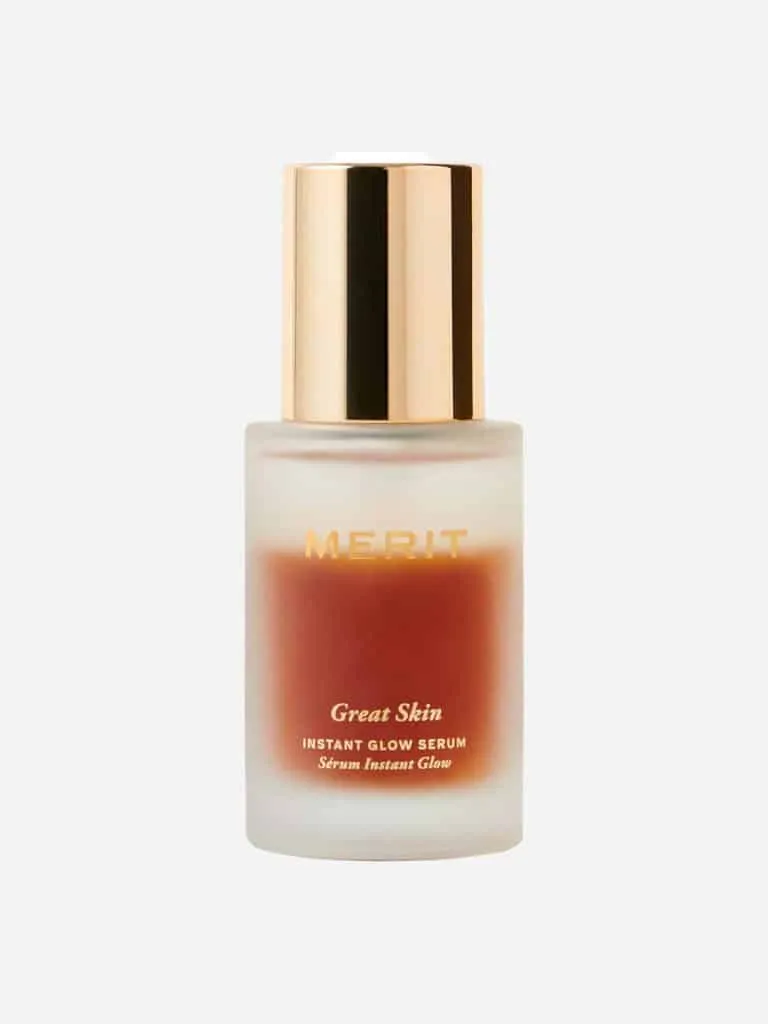 Bottle of Merit Great Skin Instant Glow Serum with a gold cap