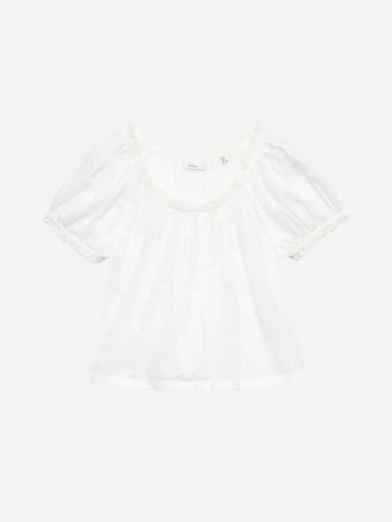 DÔEN Frederica Top in Salt: a white cotton voile blouse with puff sleeves and scalloped lace trim