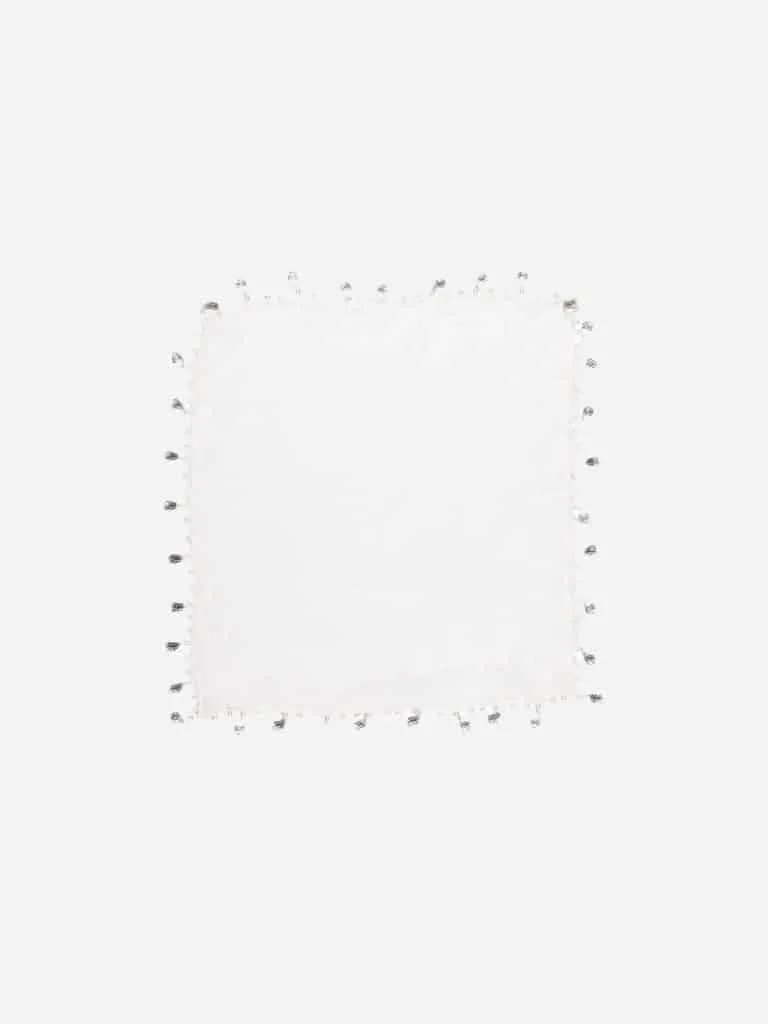 White square scarf with silver coin charms along the hem, laid flat