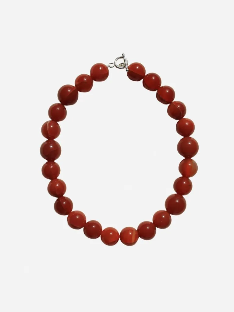 Bubble and Bead Terracotta strand of round red terracotta beads with a silver toggle clasp