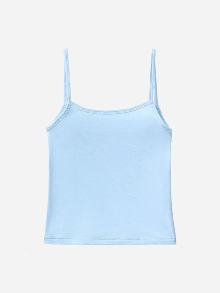 Light blue spaghetti-strap Cloud Knit cami flat lay on a pale background