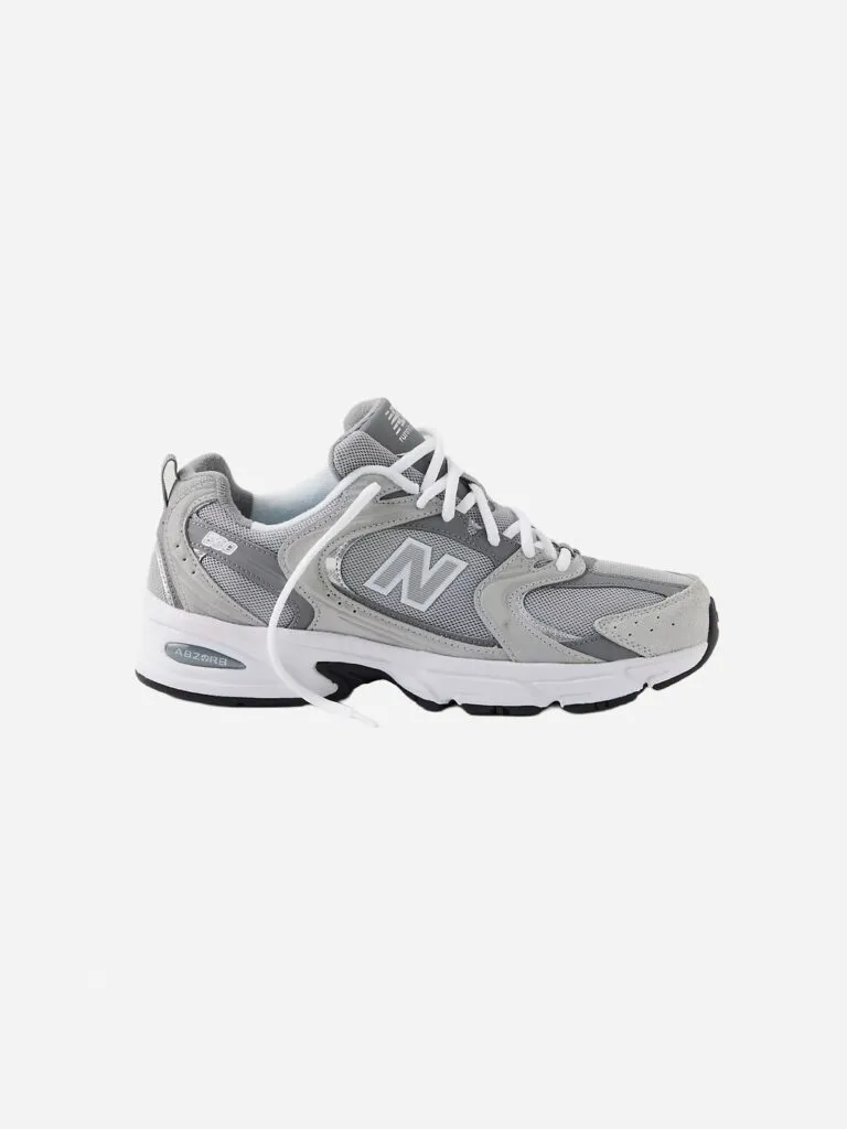 Grey and silver New Balance 530 sneaker with ABZORB midsole, side profile on white